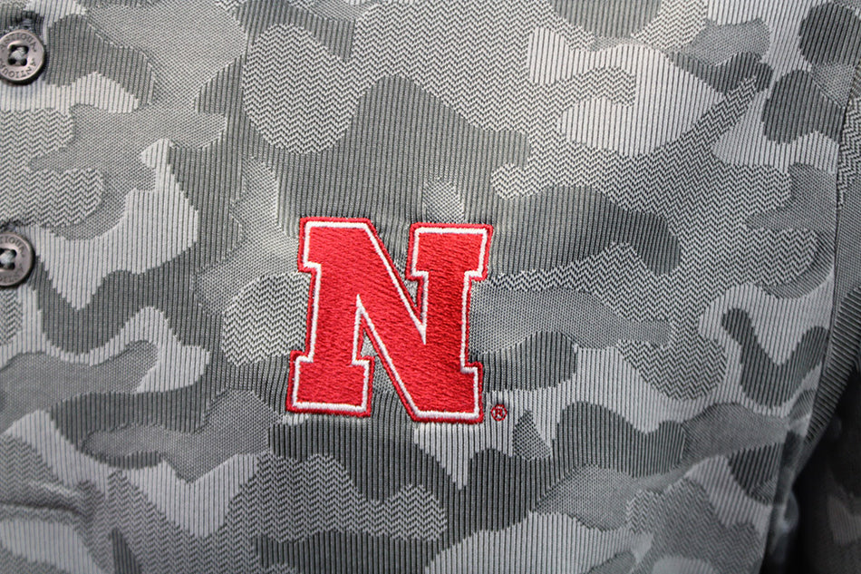 Antigua Nebraska Three Button Camo Polo