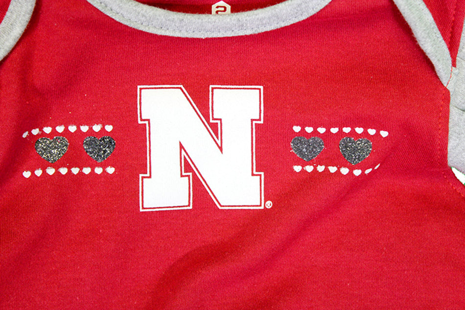Girls Nebraska Heart Ruffle Onesie