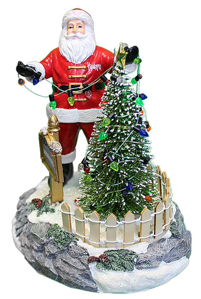 Husker Santa Stringing Lights Figurine