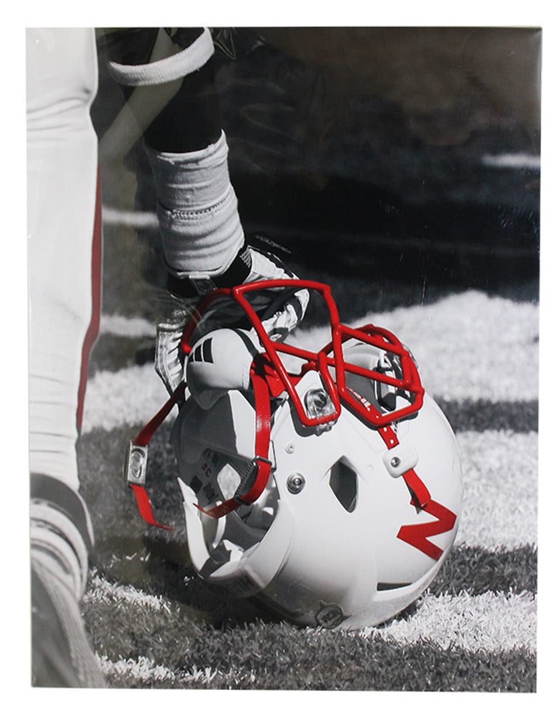 Nebraska Player Kneeling with Helmet